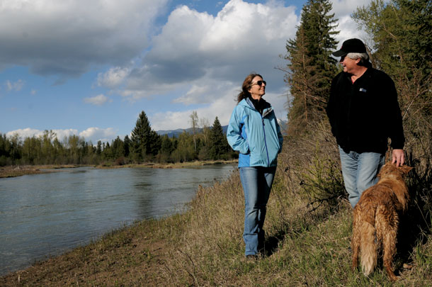 The Smiths and their dog enjoy their Flathead riverbank legacy.